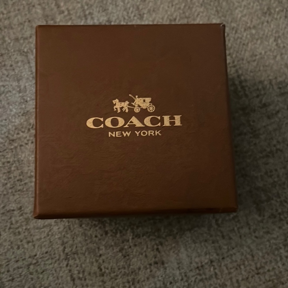 Coach watch new never worn. Brown leather.Comes with original box and pillow